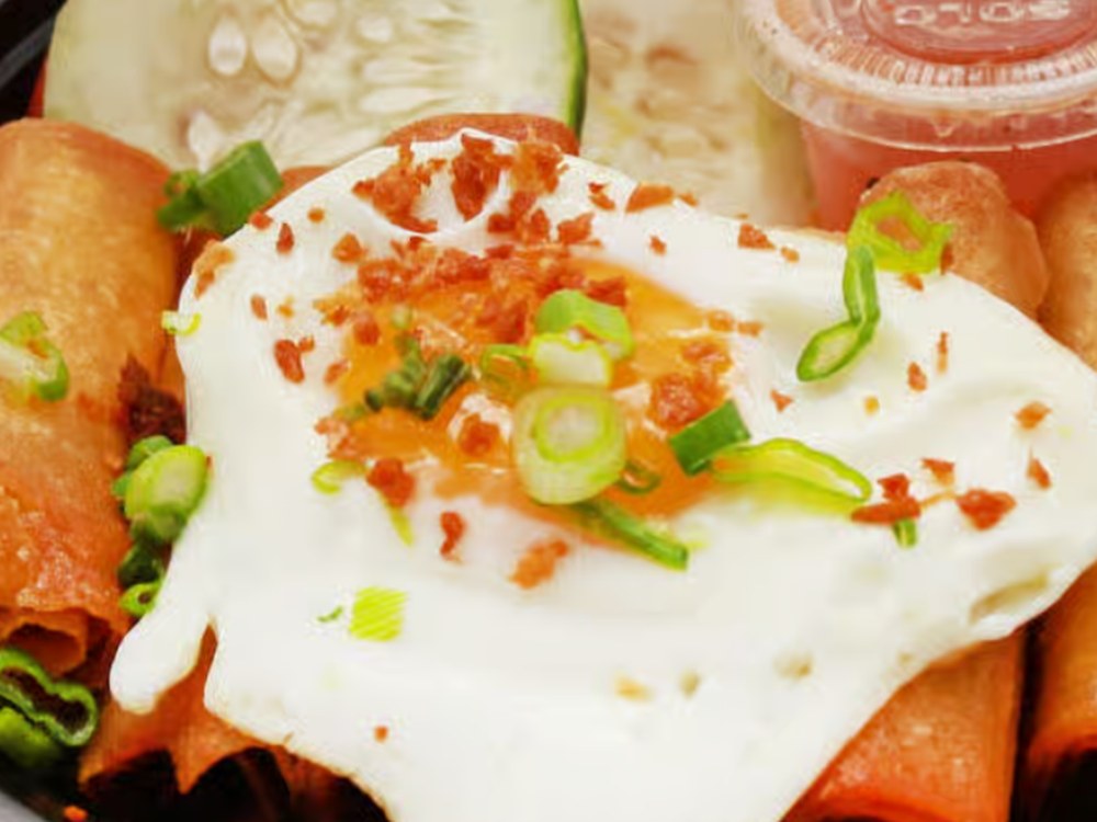 Pork Lumpia Rice Bowl with crispy spring rolls and a sunny side egg