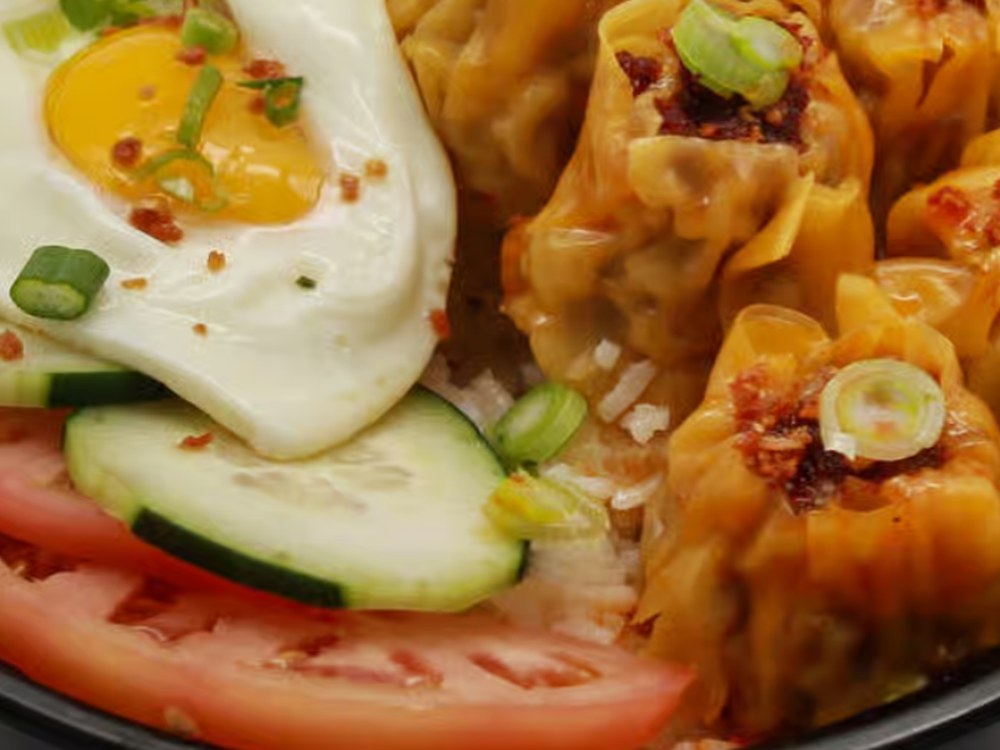 Pork Siomai Rice Bowl with steamed siomai, rice and a sunny side egg
